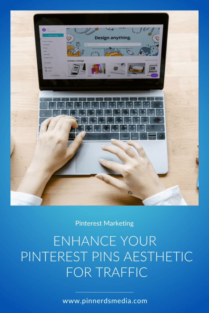 Hands using a laptop with a design program open, enhancing Pinterest pins aesthetic for increased traffic.