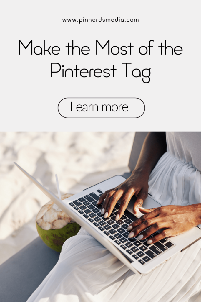 Person using a laptop on a beach.