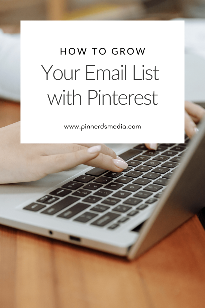 Close-up of hands typing on a laptop, representing email list growth through Pinterest.